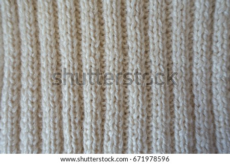 White handmade knitted fabric with vertical wales