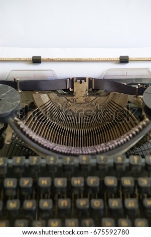 old but gold retro typewriter for old fashioned journalist or reporter. with cyrillic symbols