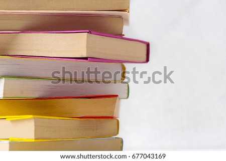  pile of paperback books on a table