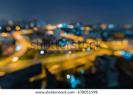 Aerial view blurred bokeh light over city road intersection, abstract background
