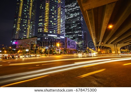 Night scene of modern city with light trails.