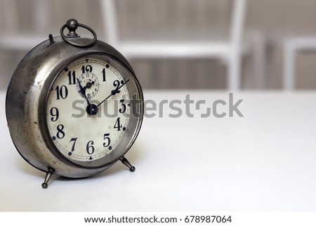 old clock on a white background. Interior shot. Nobody