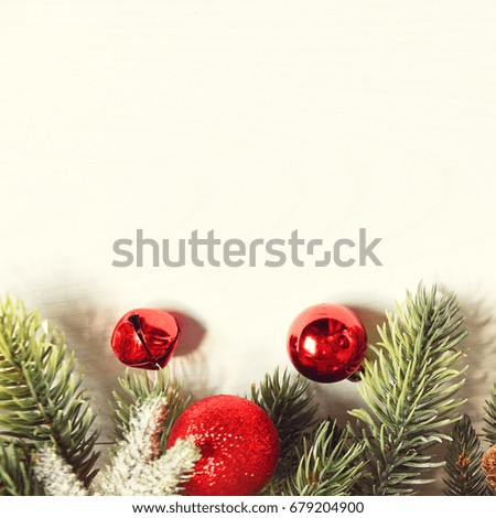 Christmas card with fir and decor on glitter background