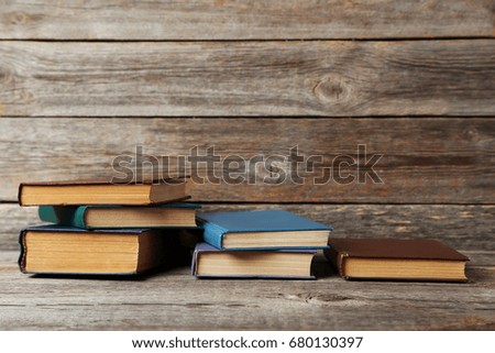 Old antique books on grey wooden table