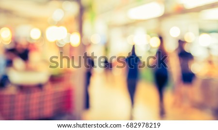 Abstract blur image of Food stall at day market with bokeh for background usage . (vintage tone)