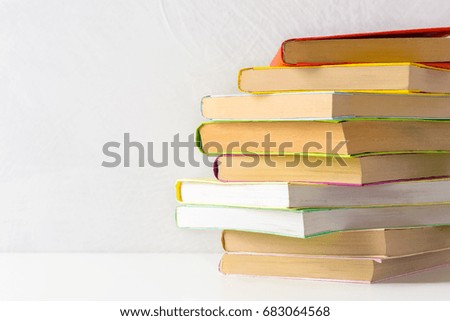  pile of paperback books on a table