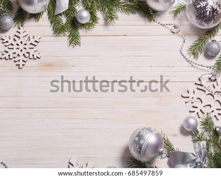 Silver Christmas decoration on wooden background