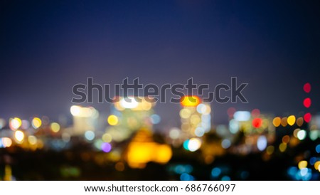 a blur bokeh picture of cityscape at night time.