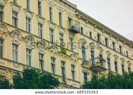 yellow and classical facades of row houses exterior