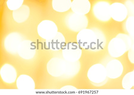 Bokeh blurry image on a golden background.