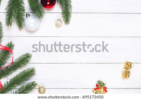 Christmas and New Year background - fir leaves and decorations on white rustic wooden background with copy space.  Creative Flat layout and top view composition