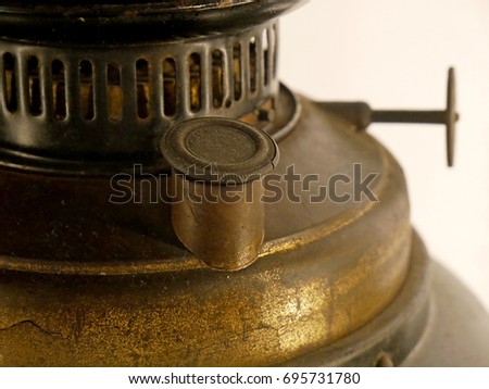 Old rusty kerosene lamp. Details closeup.