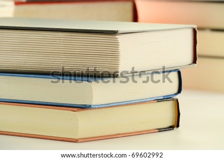 Composition with stack of hardcover books