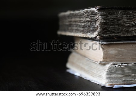 stack of old retro book on wooden brown table