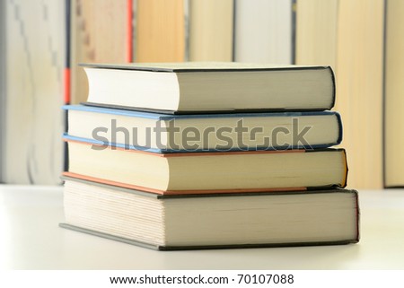 Composition with stack of hardcover books