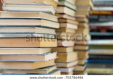 A stack of books with colorful covers. The library or bookstore. Books or textbooks. Education and reading.