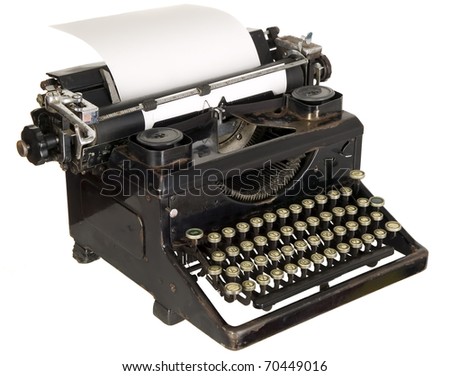 Old antique white typewriter with black keys