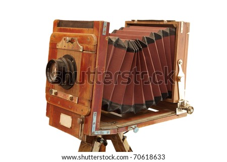 Beautifully crafted, vintage, wood and brass camera isolated over white