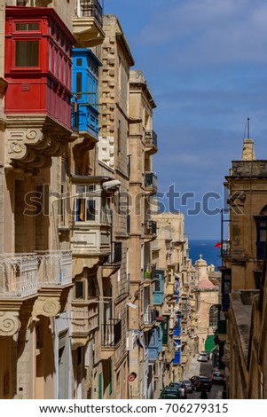 Picturesque alley with view to the Mediterranean Sea in the old town of Valletta