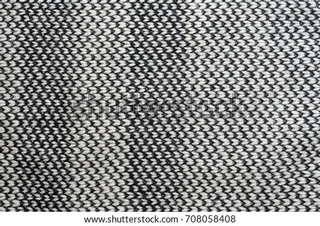 Knitting fabric texture closeup background - black and beige strip