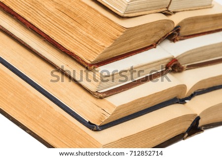 Open old book on white background.