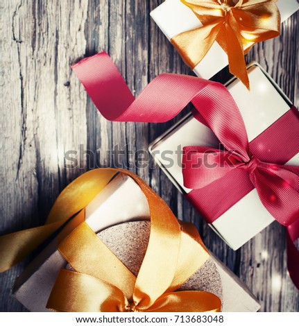 gift box with bow on wooden background