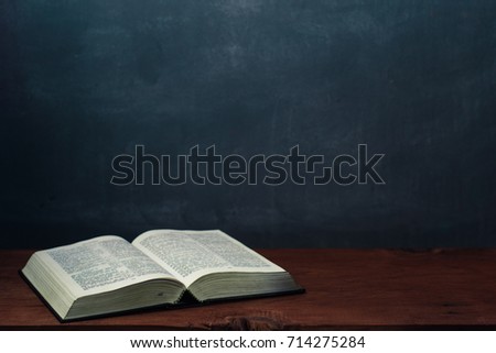 Bible on an old table. Beautiful background.Religion concept.