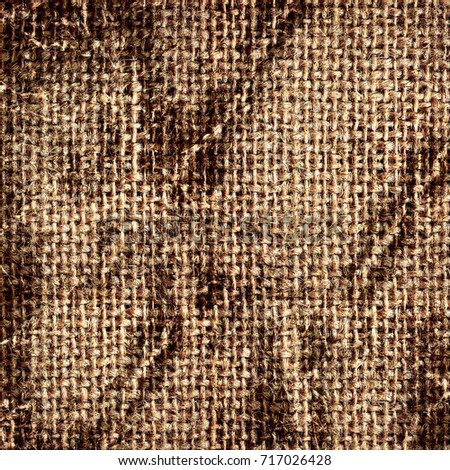 Texture of an old dirty burlap. Grunge background old fabrics in spots