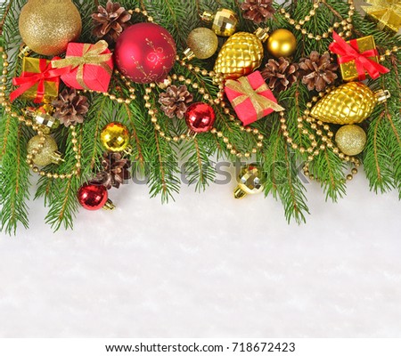 Christmas decorations on a spruce branch on a white background