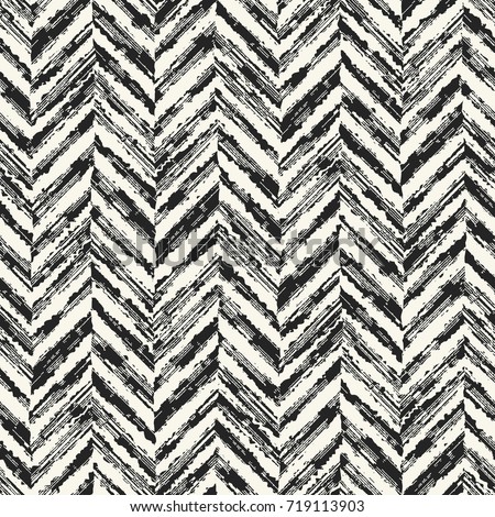 Abstract herringbone motif in rough stroke. Seamless pattern.