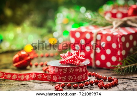 Christmas decoration with vintage ribbon spools for homemade gift boxes on christmas lighting bokeh background