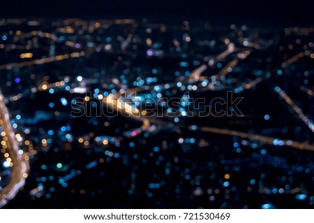 Abstract blur bokeh of night light city look from airplane