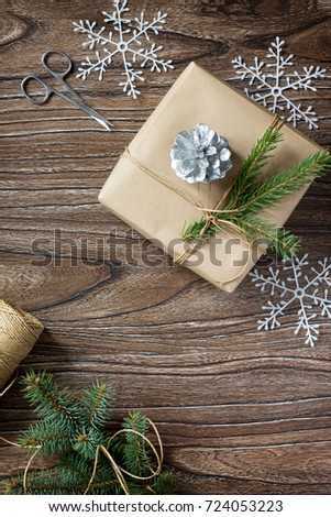 Christmas gift box. Christmas presents in handmade boxes on a wooden table. Flat lay with copy space.