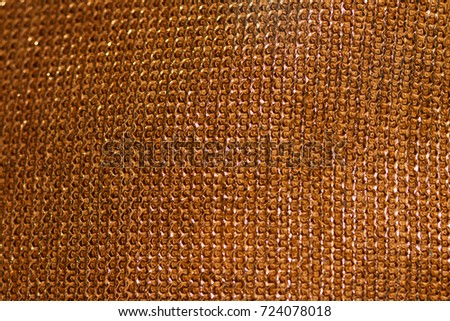 Texture of the chain mail. Gold weaving of chain mail