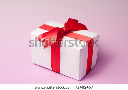 White gift box isolated over pink background