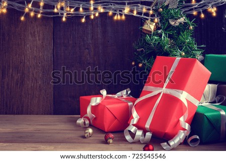 gifts and toys on wooden boards Decorated light with Christmas holidays and happy smile kids.