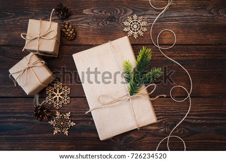 Moke up Christmas composition of gifts and wooden toys on a wooden background