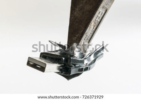 from rage, with a hammer destroyed USB stick. isolated on white background