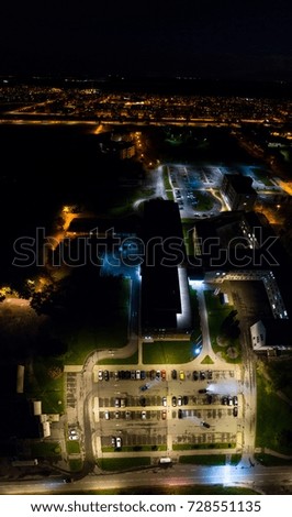 Aerial view of the city at night. Vertical panorama.