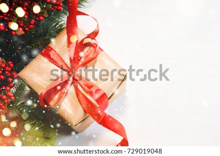 Christmas Gift Box On Wooden Background With Snowflakes, Greeting card Merry Christmas and Happy New Year
