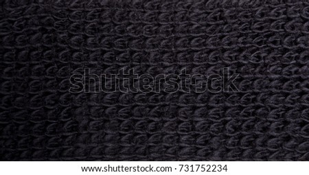 black knitted background close-up