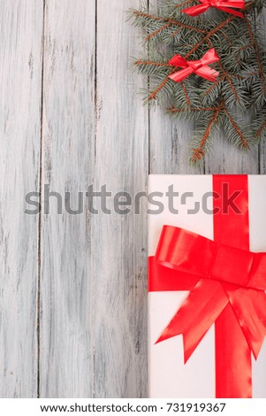 Gift box with a red ribbon on a gray background