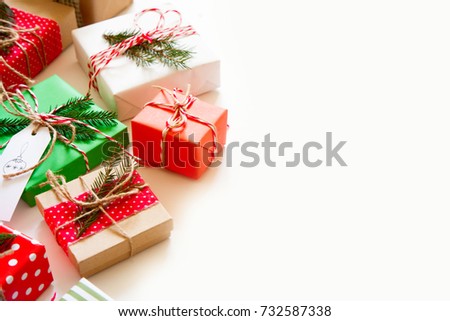Gifts packed in striped paper and polka dots. Red and green colors.