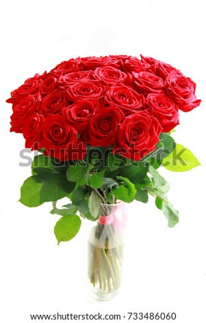 Beautiful bouquet of twenty five red roses isolated
