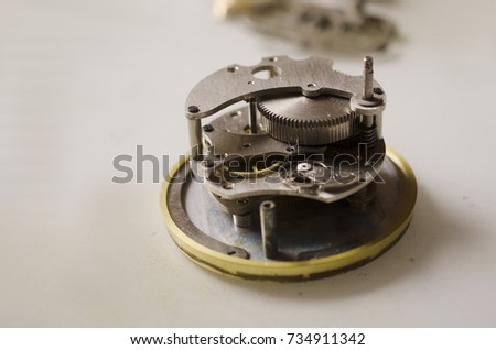 disassembled alarm clock close-up on a white background