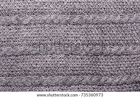 Gray knitting wool texture. Warm handmade background.