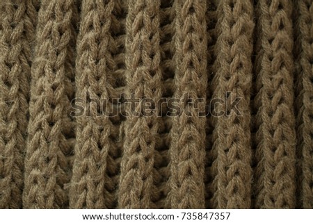 Knitted fabric texture and background. Green knitted fabric texture. Close up view of knitted fibers texture. Abstract texture and background for graphic design. Macro view of green fibers. 