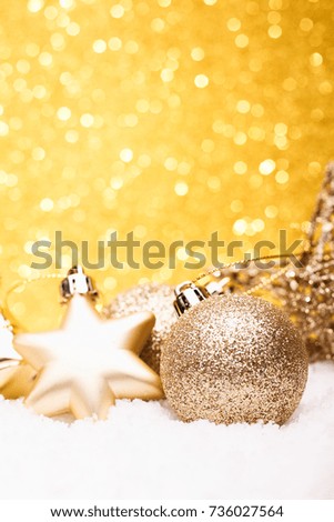 Christmas composition of Christmas tree toys on a gold background.