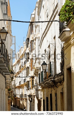 A typical old narrow street in the historical town of Cadiz, Spain