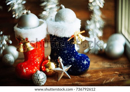 background, texture, on the theme of New year and Christmas: boots Santa with toys and gifts